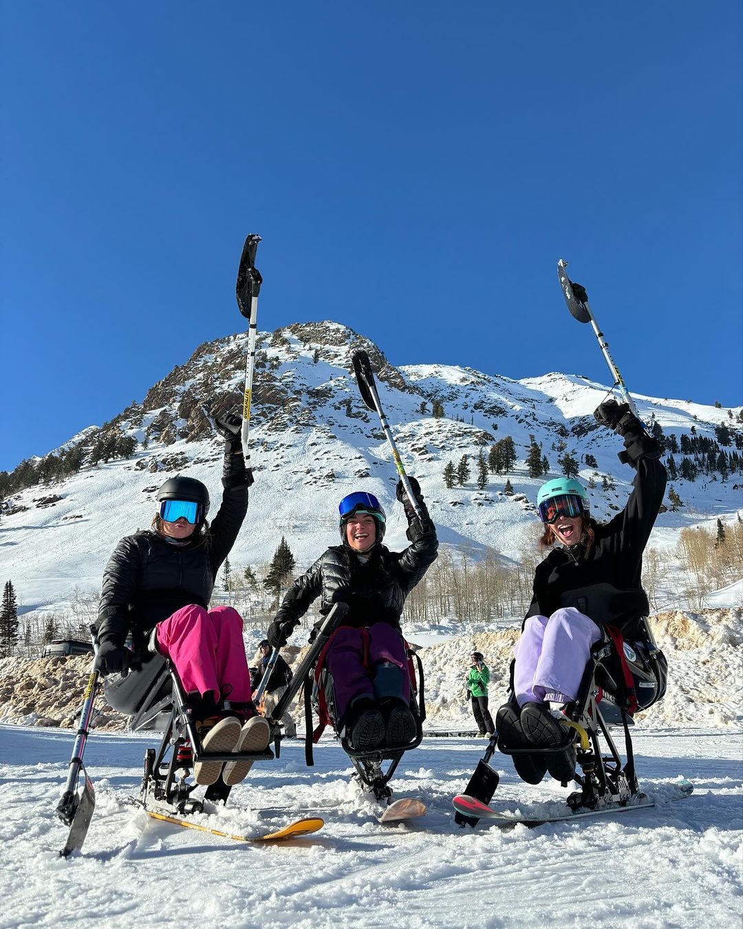 Three adaptive sports skiers wearing STAGE Propnetic Magnetic Ski Goggles