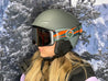 Woman wearing STAGE Custom Ski Goggles featuring the Adaptive Sports Partners logo on the strap of a STAGE Propnetic Magnetic Ski Goggle.