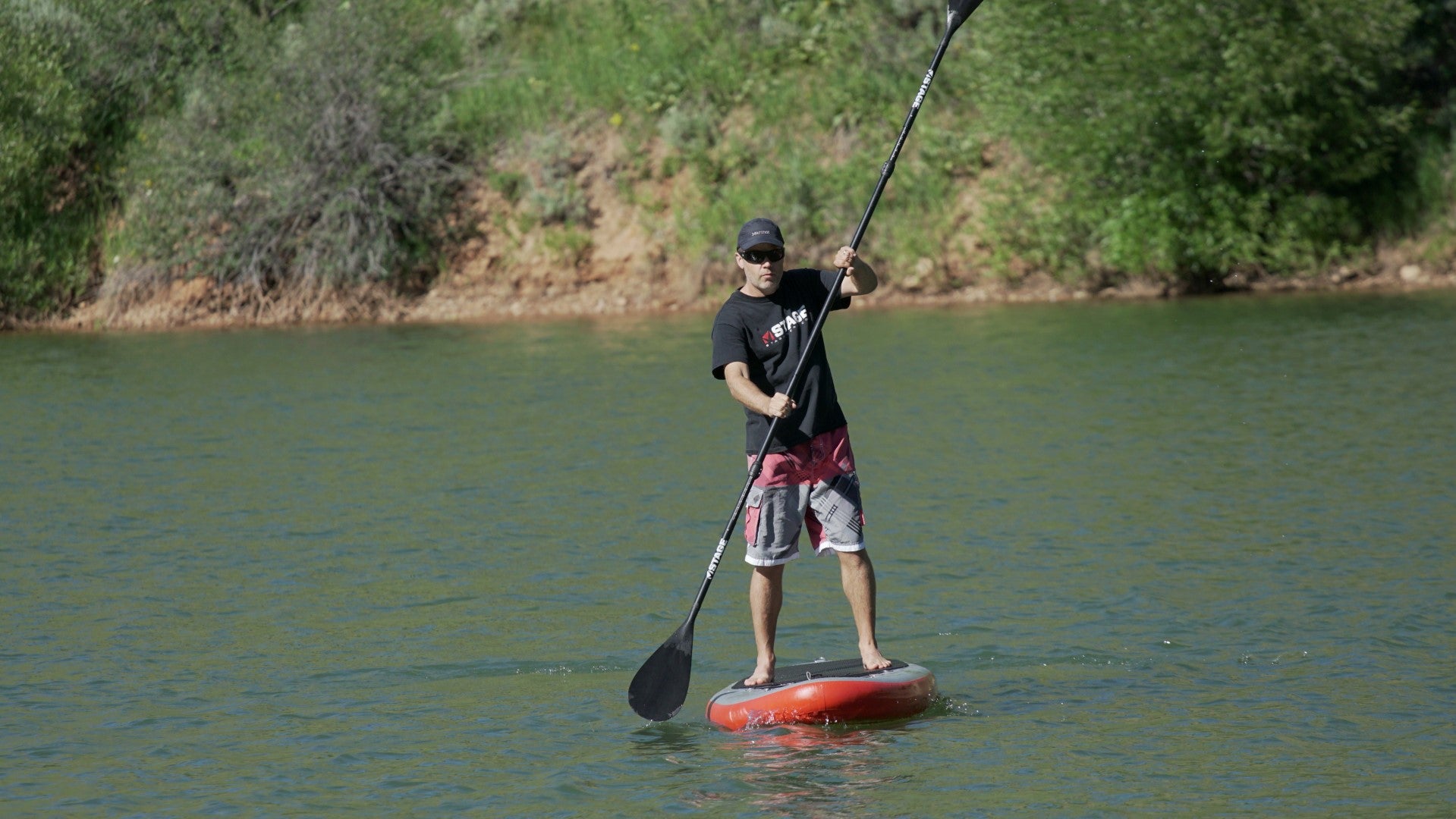 Man using the STAGE 2SIDE Double-Sided Paddleboard Paddle on Pineview Reservoir in Utah.