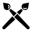 A vector image of two paint brushes representing STAGE's custom goggle free digital mock-up policy. 