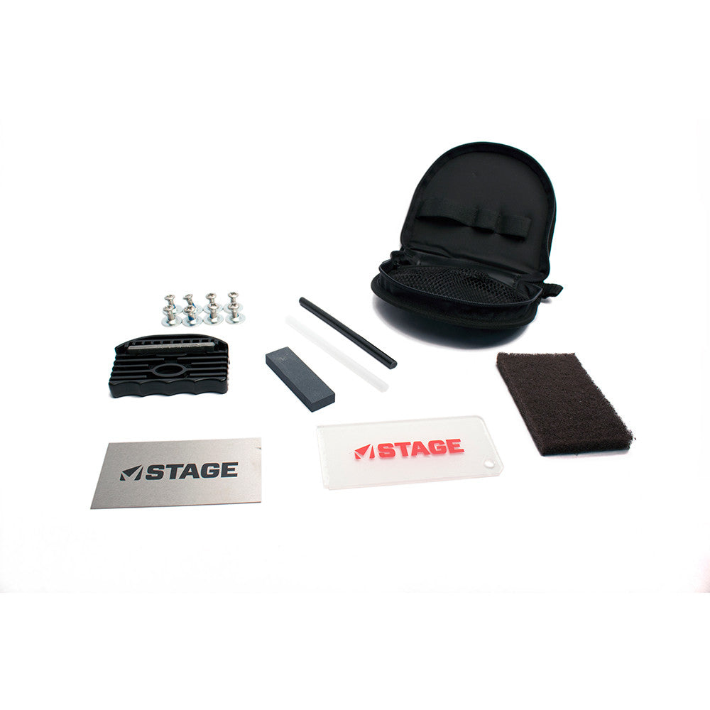 STAGE Snowboard Tuning Kit includes a carrying case, edge tuner, snowboard binding screws, clear and black p-tex, edge stone, P-tex scraper, wax scraper, and scrubber.
